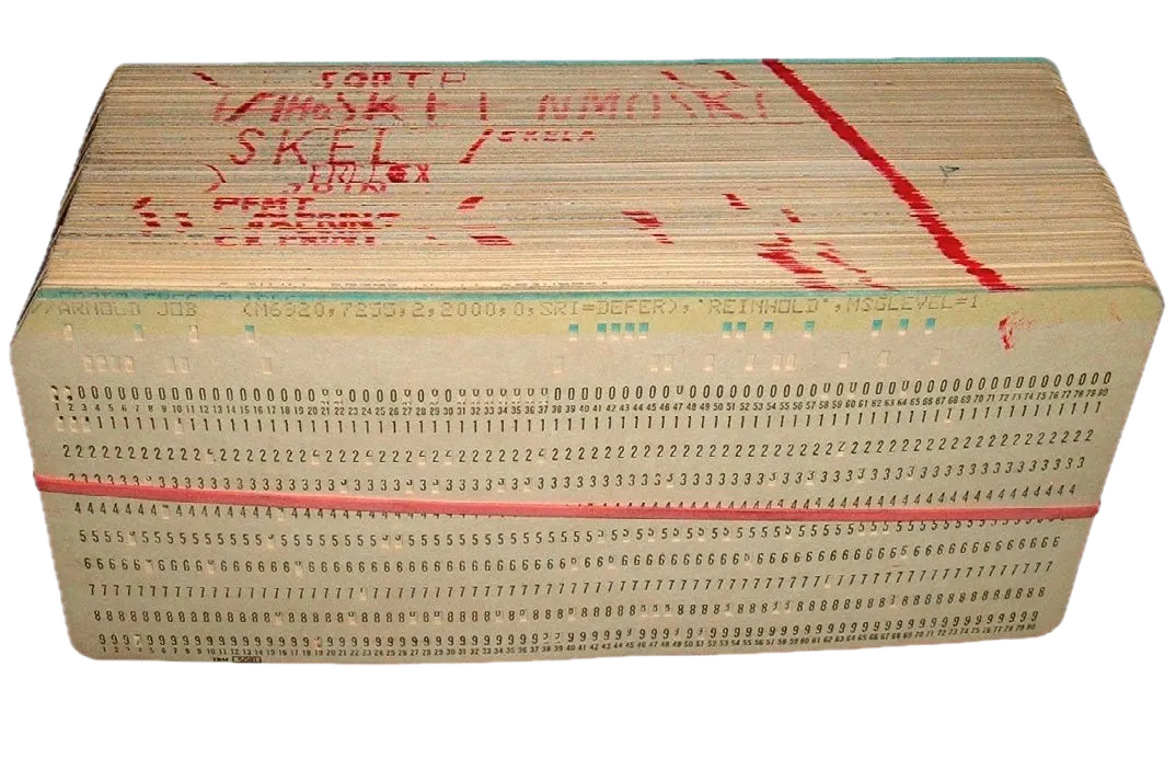 A thick stack of vintage punch cards bound together, representing a complete computer program. The cards have a tan/beige color and show multiple rows of numbers (0-9) with punch holes throughout. The top card has handwritten red text that appears to read 'FORTRAN' along with other notations including 'SKELTON'. A red diagonal line is drawn across the top edge of the deck. The side view shows the thickness of the deck, revealing hundreds of stacked cards that would have been fed sequentially through an optical card reader to execute the program. This illustrates how early computer programs were physically substantial objects, with each card in the deck representing one line or instruction of code.